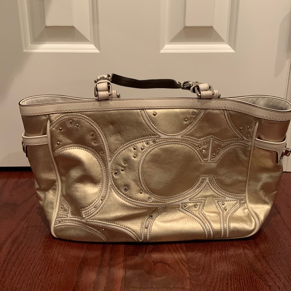 Gold leather coach tote purse with cream accents and rhinestones